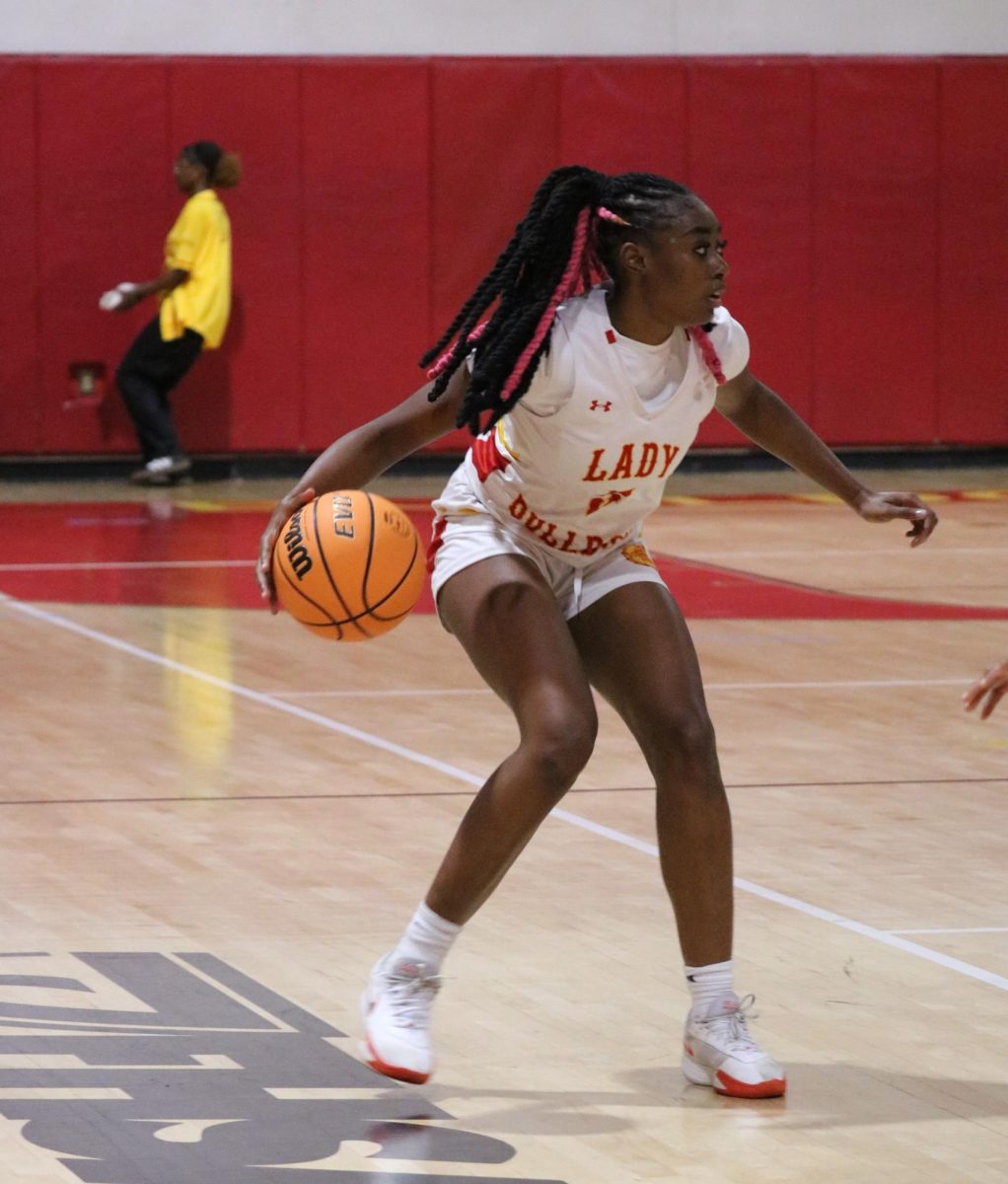 Captain Ayonna Lewis commands the offense with determination, setting herself up for a crucial point.