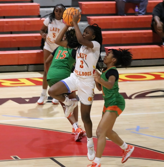 Freshman Paris George shines on the court, showcasing skills with a flawless layup.