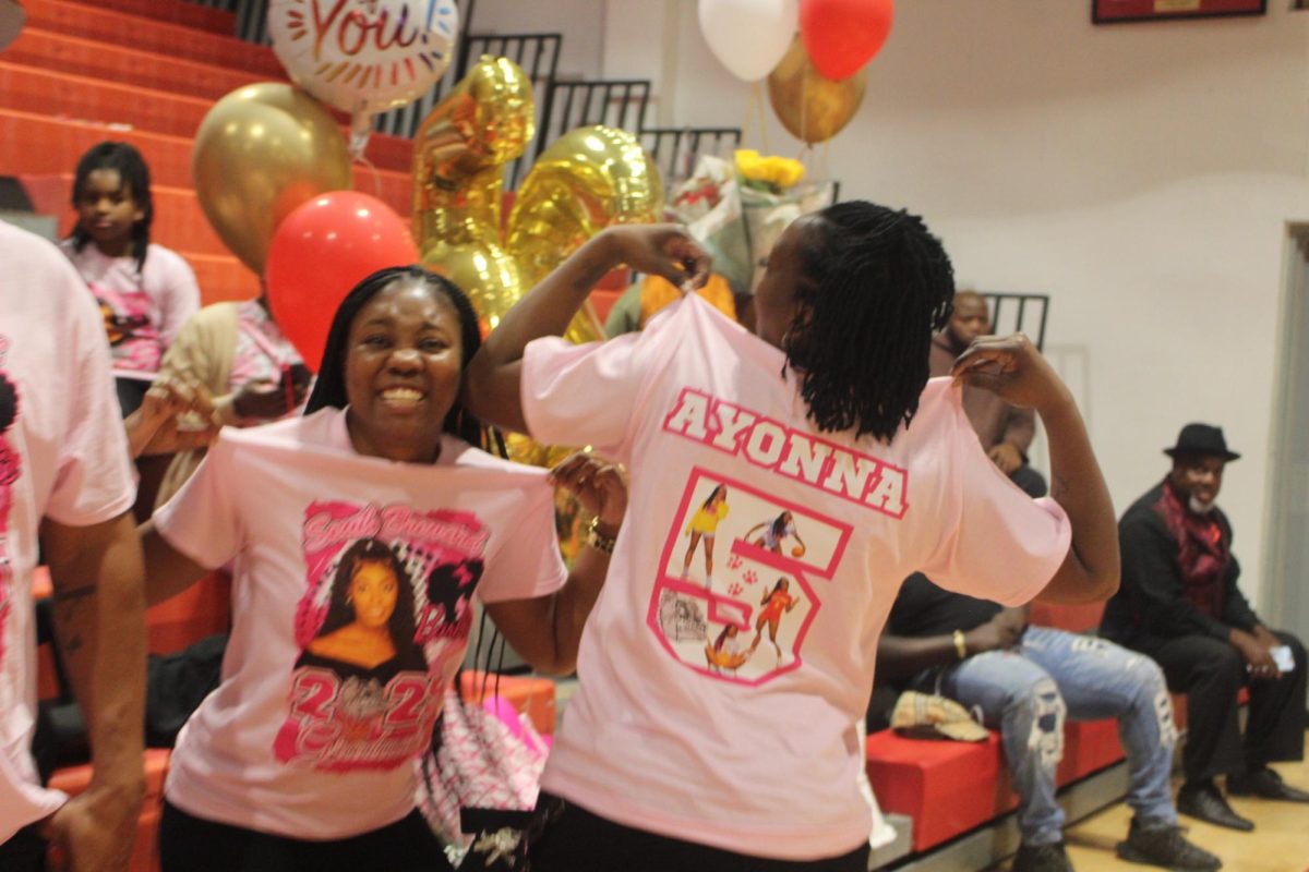 Ayonna Lewis' family supports her by showing off their merch.