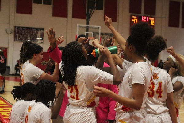 SBHS Girls and Coach Ferguson salute and break after a few words of encouragement.