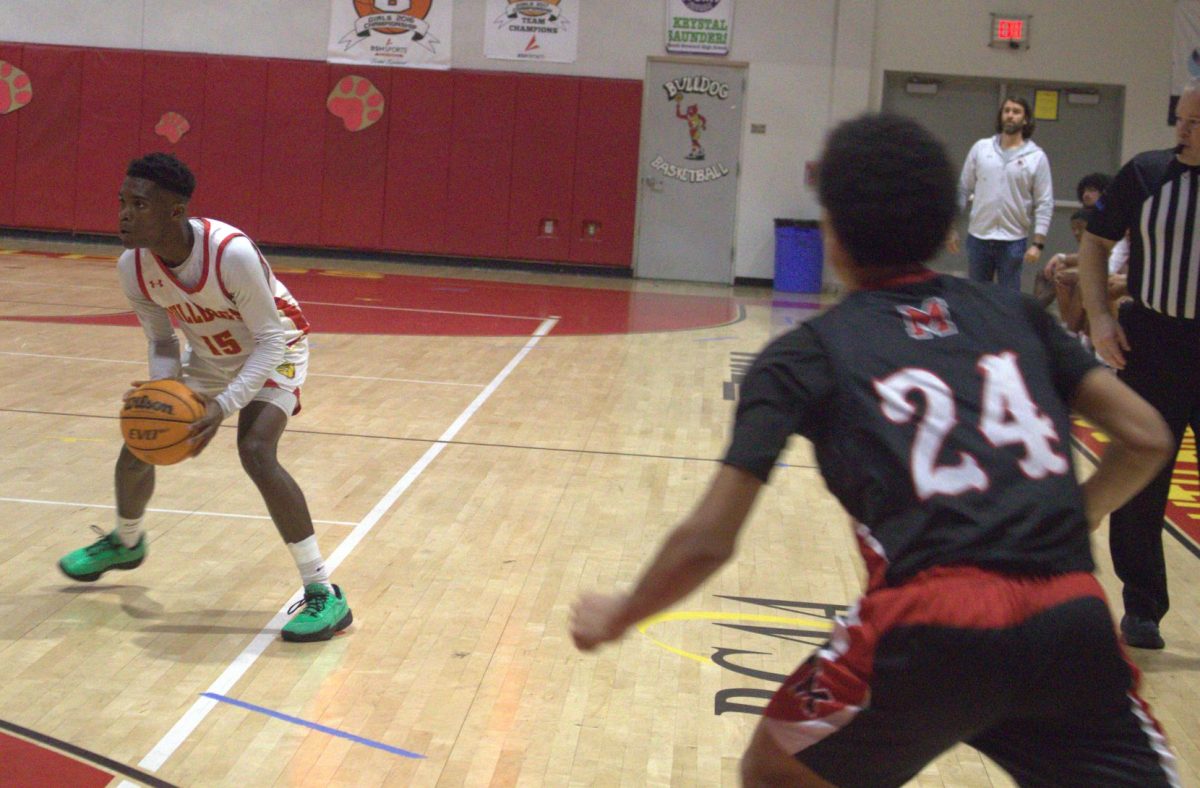 SBHS junior, Trent Jeffers defends the ball as he tries to move between players in front and on his side. 