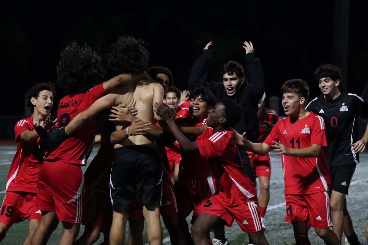 SBHS wins against St. Thomas Aquinas as they celebrate their victory as a team. 