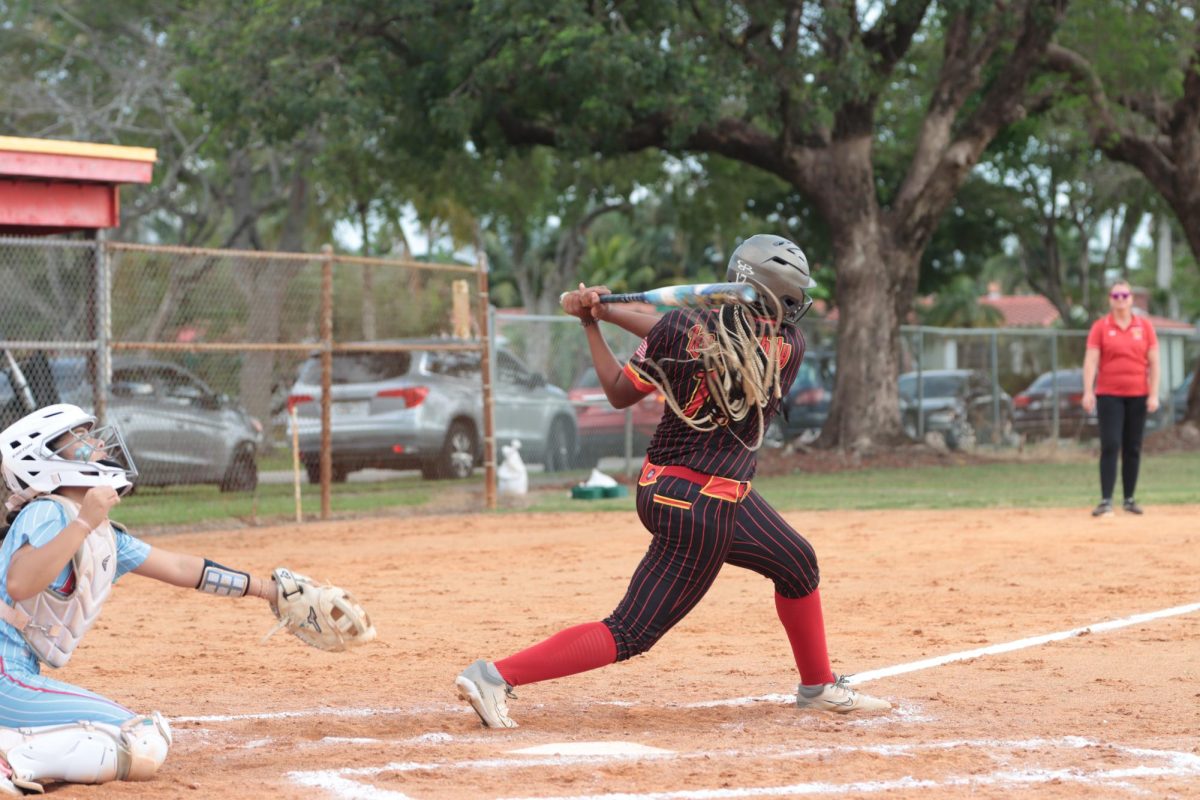 Ms. Clutch Delivers: SBHS senior Onya Golightly makes hard contact with the ball against the Chaminade pitcher. Onya recently signed to a full ride scholarship for softball at Florida National University