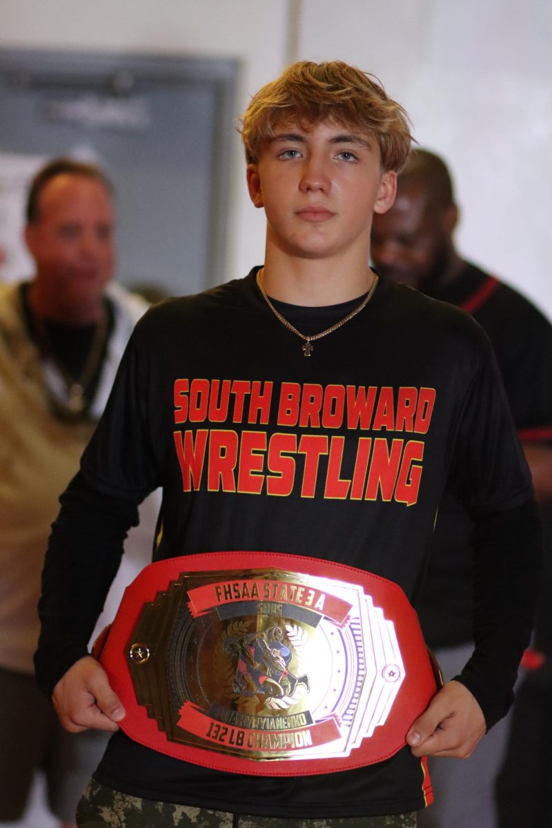 Illia Kyryianenko holds his FHSAA State Championship belt. 