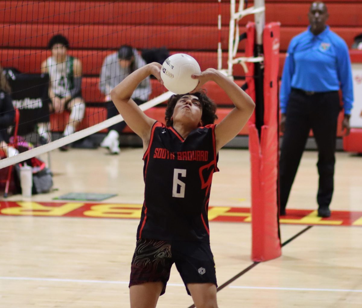Sophomore setter Jorge Zamudio delivers a flawless set, teeing up his teammate for a powerful spike.
