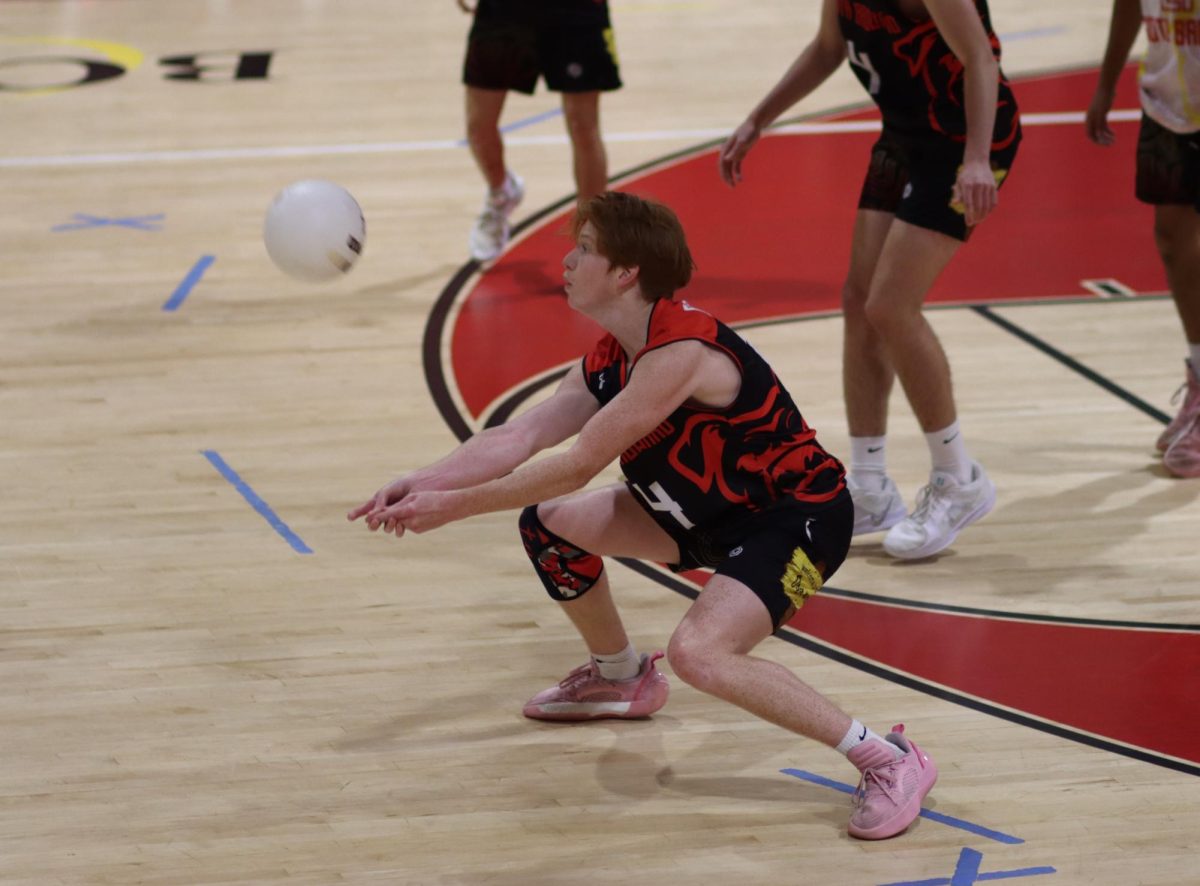 Nathan Carlson digs deep on defense, making a clutch save off a spike to keep the rally alive.