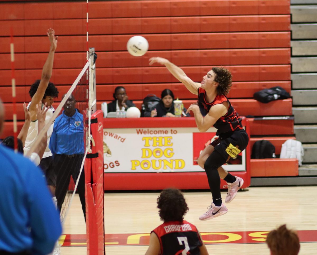 Junior Aiden Aguerre springs into action, slamming down a pivotal point for South Broward late in the fourth set.