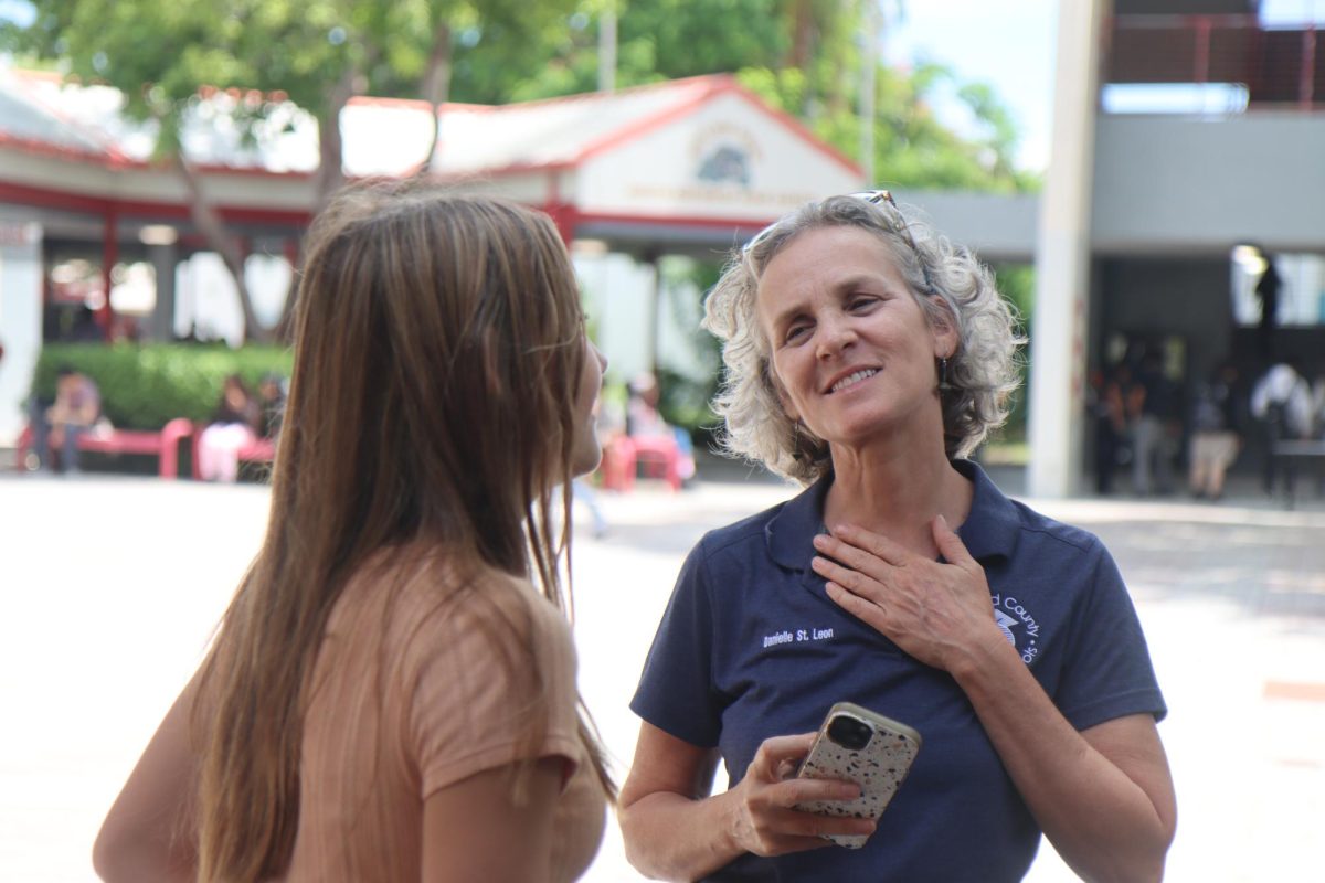Danielle St. Leon from Broward Schools engages enthusiastically with senior Katie St. Piere, as they discuss the student-led efforts to raise awareness about gun violence.