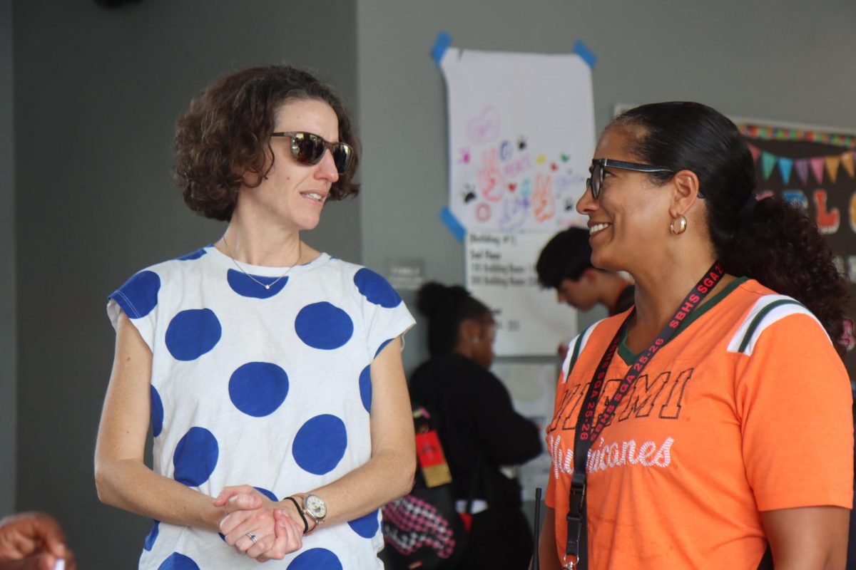 District 1 Representative Maura Bulman for Broward County and AP Mrs. Bergeron share a brief moment to discuss the student-led activities at hand.