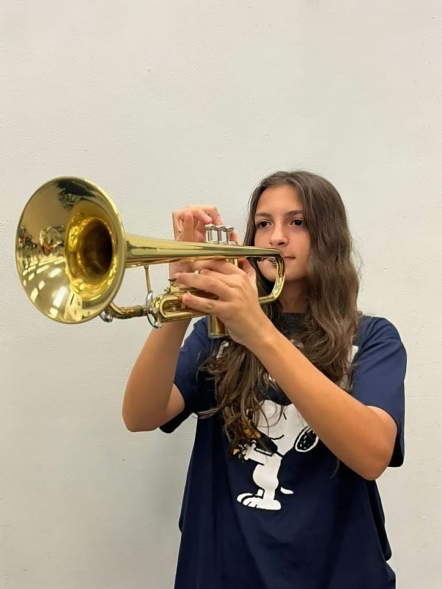 Erika Alvarez sharpens her trumpet skills, focused on hitting every note just right.