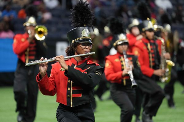 Herliantis Rose performs a focused flute feature as the marching band takes the field during their showcase. Courtesy of Florida Classic homepage.
