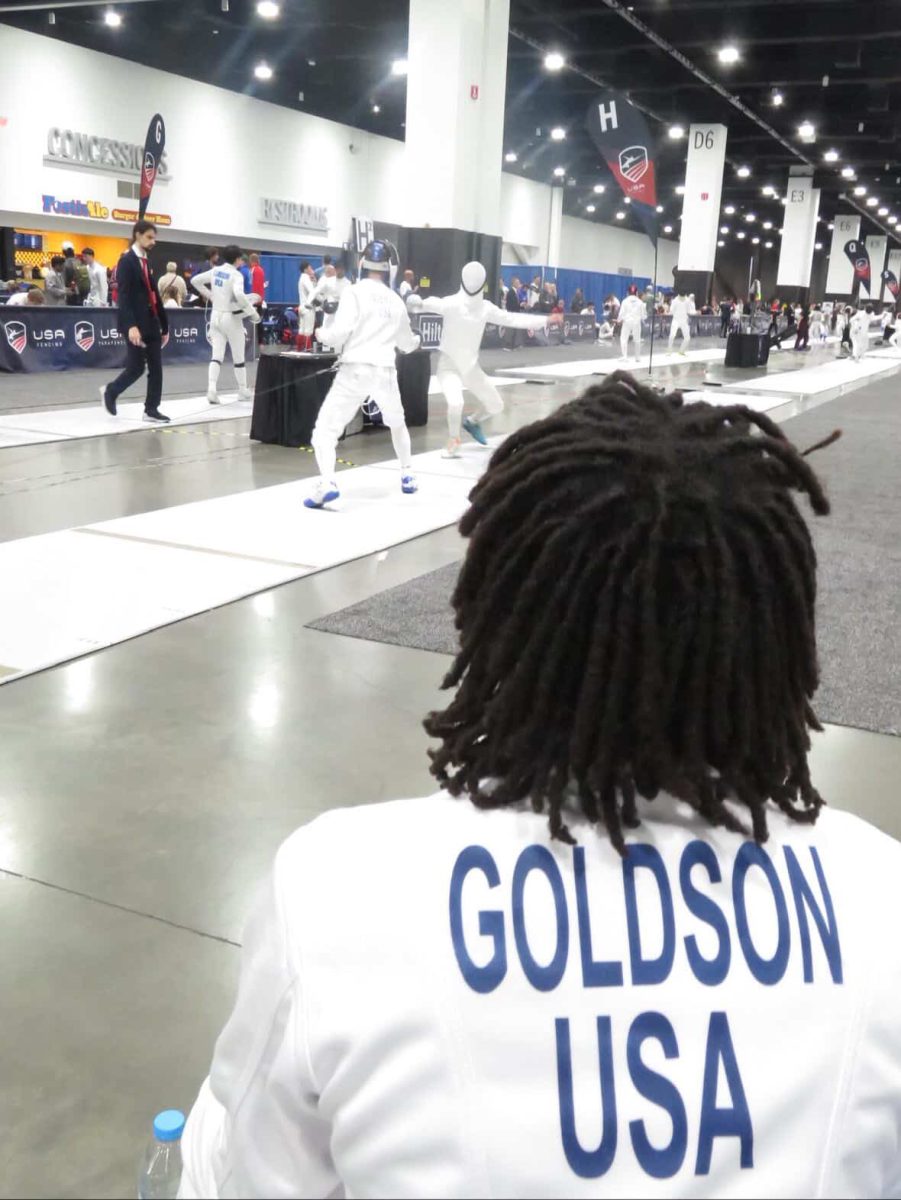 Tyrese Goldson studies the moves of other fencers an Epee match at competition.